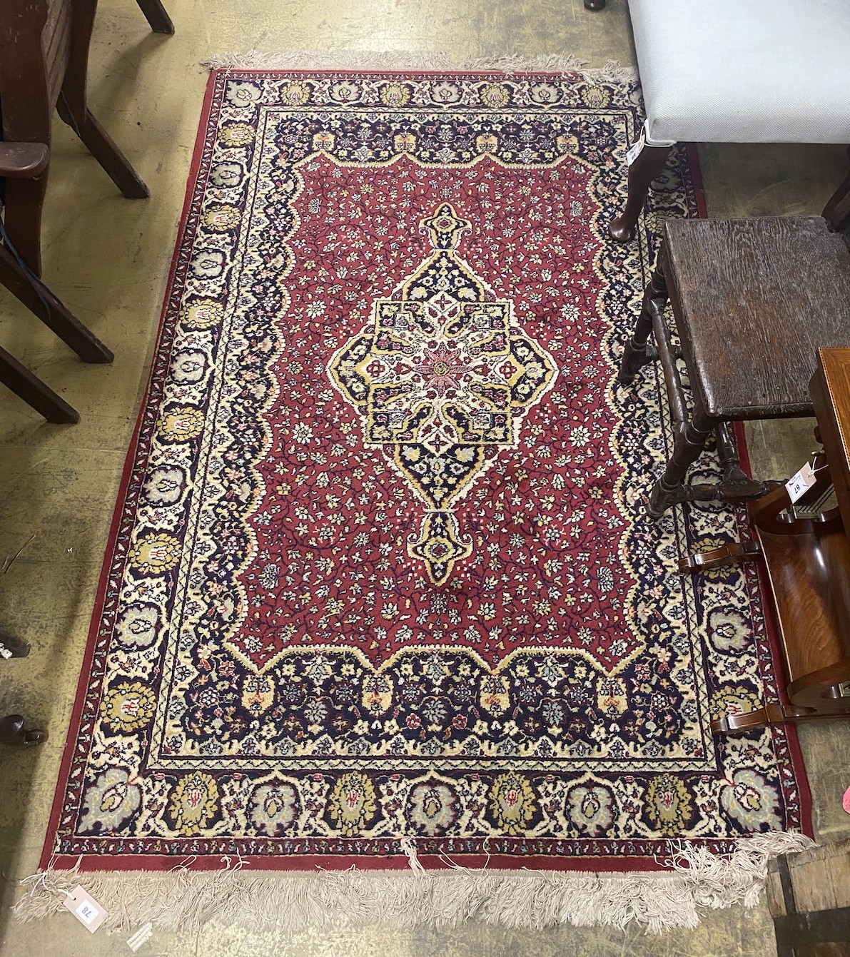A North West Persian style burgundy ground rug, 200 x 130cm